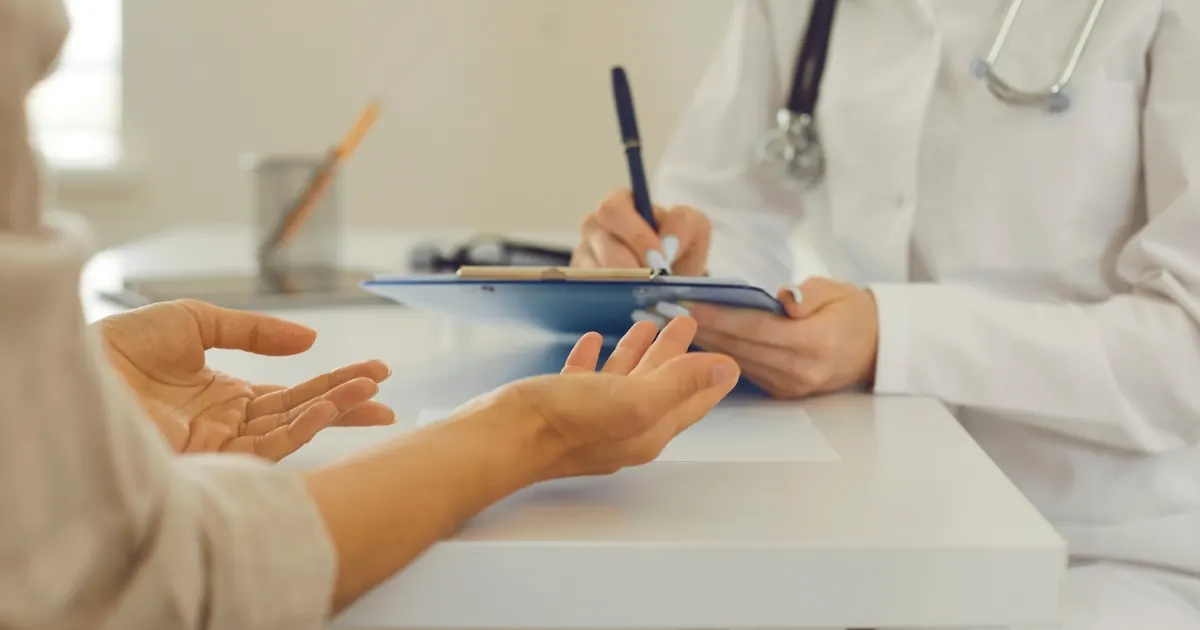Doctor reviewing medical records with an international patient — guide to complications after treatment in Turkey